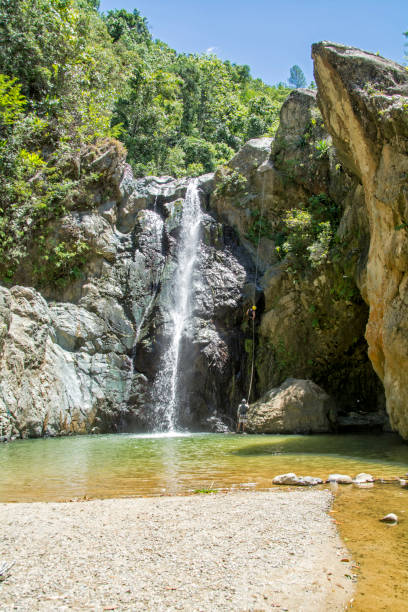 istock Young people practice cayoning in the Jimenoa waterfall 1325982716