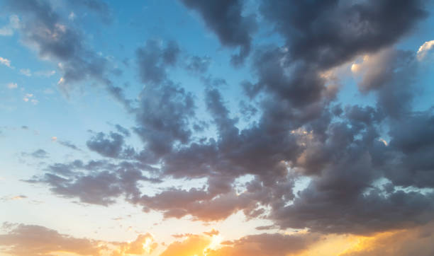 istock Amazing summer sky with beautiful orange clouds after sunset. Sky background. 1325982745