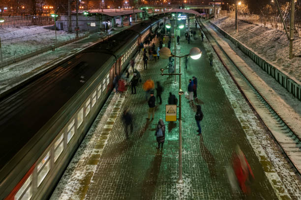 after the end of working day,  people depart home on train - depart imagens e fotografias de stock