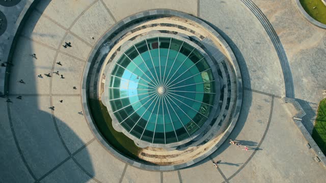 Top view on Structural glass facade curving roof of fantastic office building. 4k stock footage.