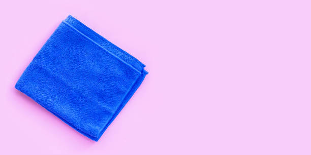 istock Blue towel on pink background. Copy space 1325985124