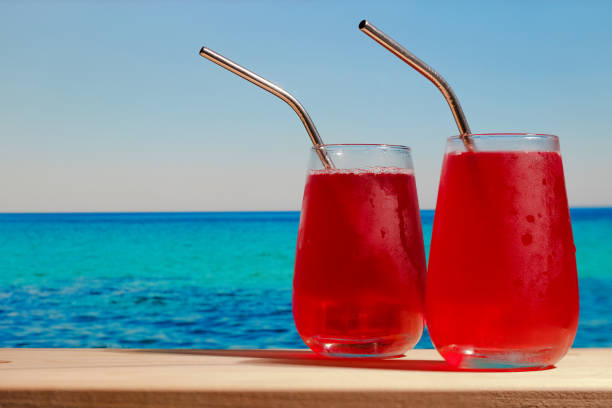 istock Two summer cherry cocktails on the beach 1325985787