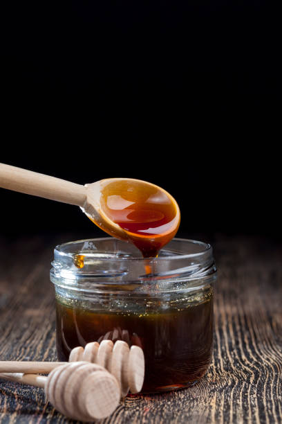 istock current thick and delicious sweet honey, close up 1325985876