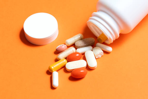 istock Pills on orange 1325986002