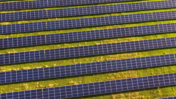 istock Aerial drone view flight over solar power station panels. 1325986881