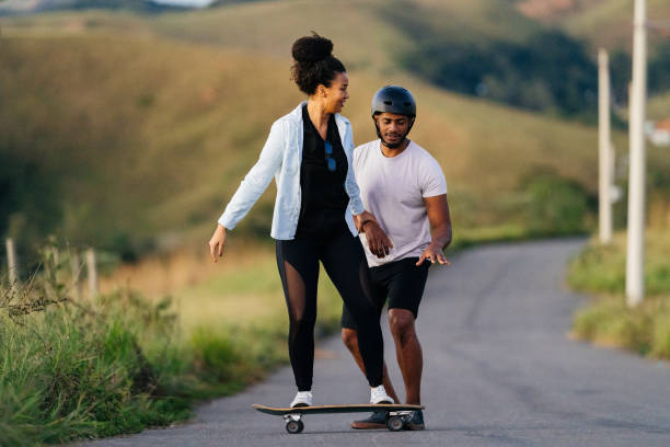 istock woman learning to skate 1325987680