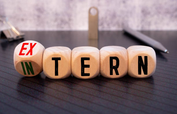 Cubes, dice or blocks showing the words external and internal on wooden background