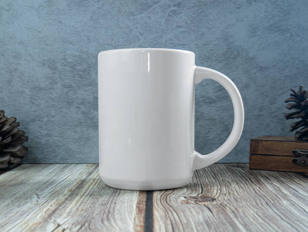 istock white mug on table wood for mockup or background 1325993466