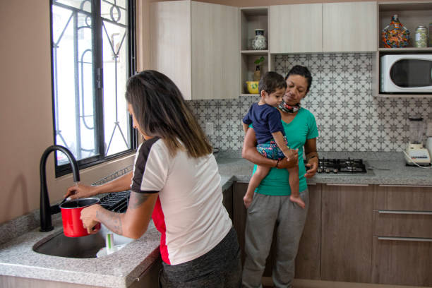 istock Moms with children in the kitchen 1325993595