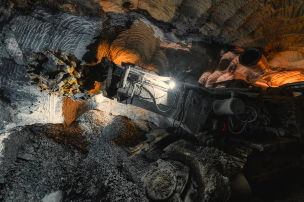 istock Underground mining of ore. Drilling head of a mine roadheader 1325996615