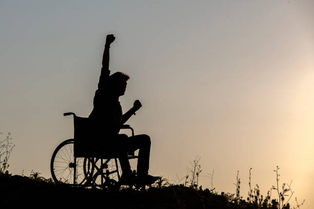 istock Disability man success on wheelchair 1325997318