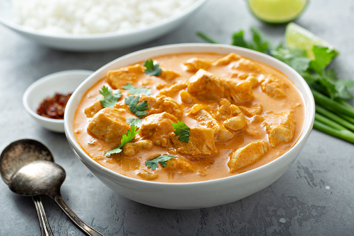 Chicken and cashew red curry in a bowl, thai inspired dish