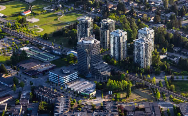 Aerial View from an Airplane of Residential Homes and Buildings Aerial View from an Airplane of Residential Homes and Buildings near Surrey Central Mall. Greater Vancouver, British Columbia, Canada. surrey british columbia stock pictures, royalty-free photos & images