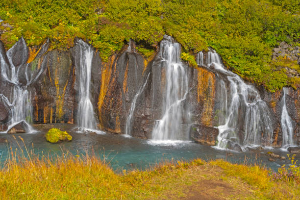 istock Quiet Falls Flowing Out the Volcanic Rock 1326005808