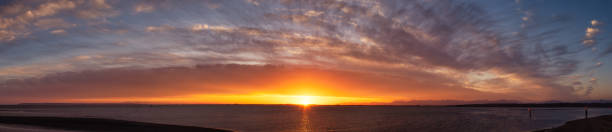 istock Beautiful Panoramic View of colorful cloudscape during dramatic sunset. 1326005822