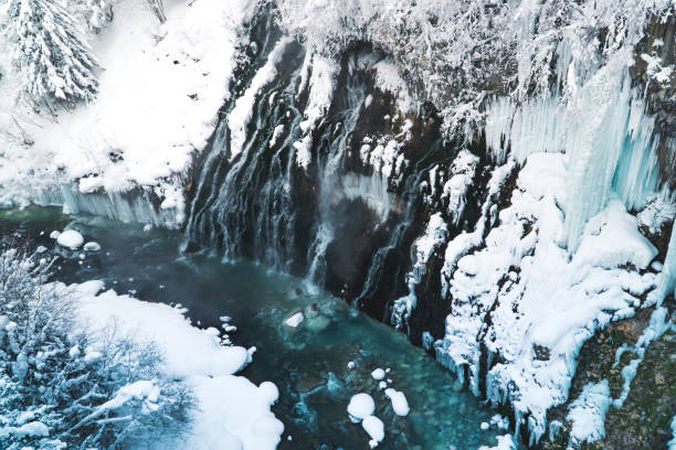 istock Beautiful nature white snow scenery Shirahige waterfall biei river on winter. 1326007763
