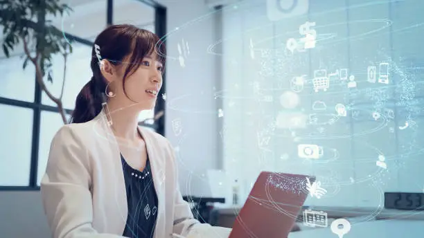 Photo of Communication network concept. Young asian woman in the office.