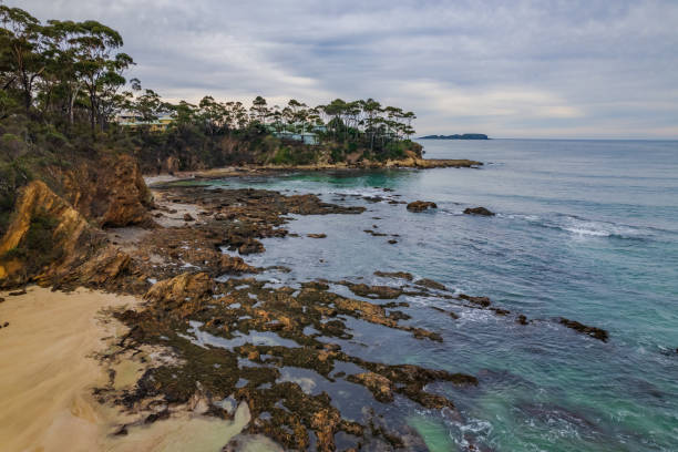 istock Cloudy morning seascape at Denhams Beach 1326012092