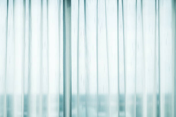 istock Large white bright windows with transparent curtains. Horizontal photo. 1326016193