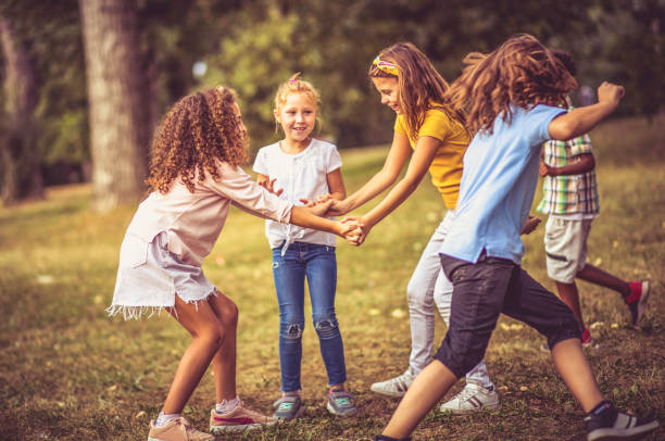 istock Large group of school kids having fun in nature. 1326018606