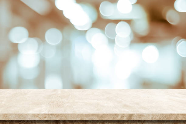 istock Empty brown cement table over blur store background, product display montage 1326020276
