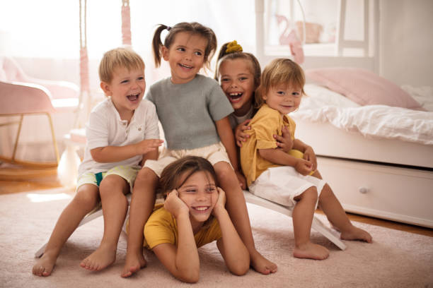 istock Group of happy kids in bedroom. 1326020635