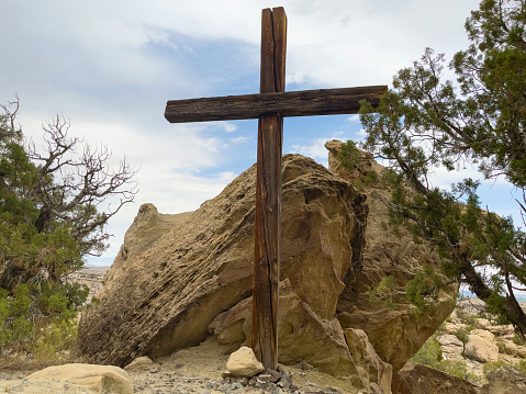 Afternoon Daytime Fitness Hike in Western Colorado Rough Terrain Arid High Desert on a Sunny Summer Day View of Wooden Cross Matching 4K Video Available (Professionally retouched - Lightroom / Photoshop - downsampled as needed for clarity and select focus used for dramatic effect)