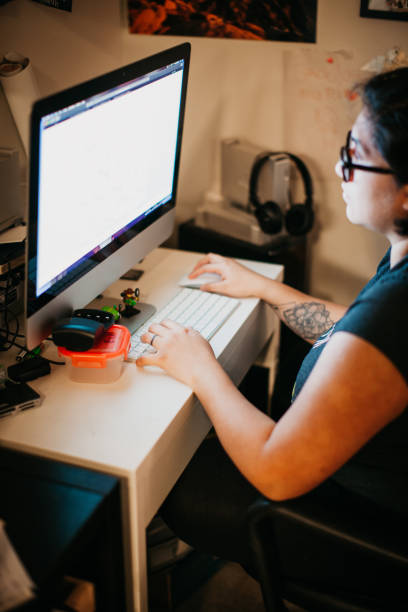 istock Hispanic Woman Working From Home Desk at Night 1326022715