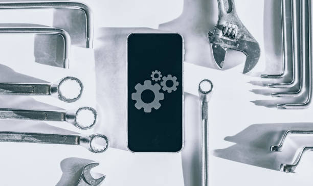 istock Mobile repair service. Technician workplace with phone and special repairing tools. Electronics repair service, device production concept. 1326022760
