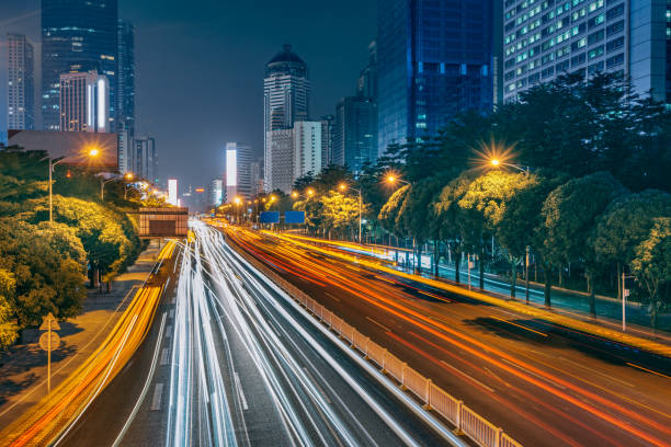istock traffic light through city at night in china 1326023445