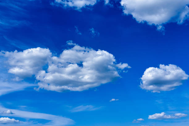 istock White cumulus clouds on blue sky background, natural phenomenon, natural phenomenon background and texture 1326025992