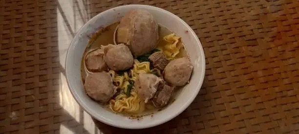 A hot and delicious meat ball with broth beef