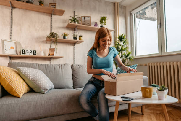 istock Woman customer opening cardboard box parcel 1326026902