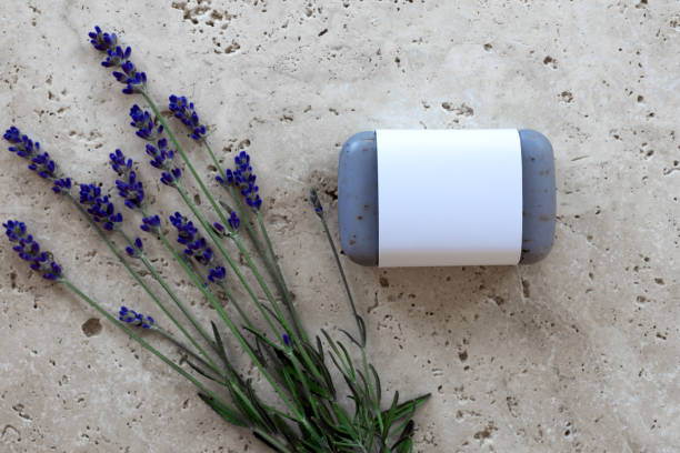 Lavender soap with lavender flowers on stone plate