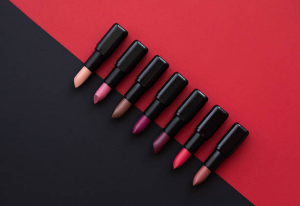 istock womens lipstick cosmetics on dark background 1326027542