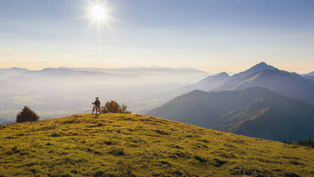 istock Mother and daughter riding mountain bikes in nature 1326031146