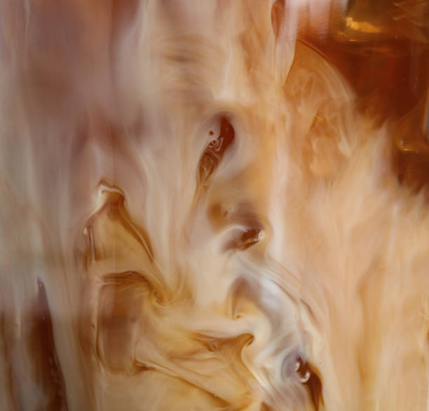 glass with cold coffee and milk, closeup - drink close up dairy product flowing imagens e fotografias de stock