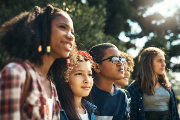 Shot of a group of teenagers having fun in nature at summer camp The world is waiting to be explored teen wishing stock pictures, royalty-free photos & images