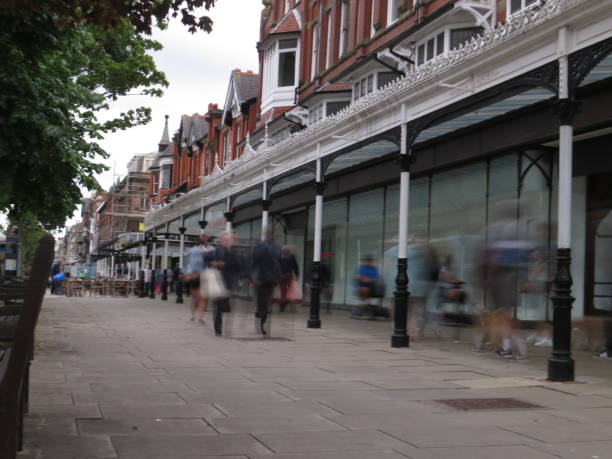 istock Shoppers walk past abandoned  shop fronts 1326032941