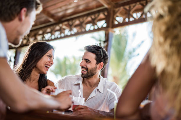 istock Young happy friends talking in a bar. 1326035196