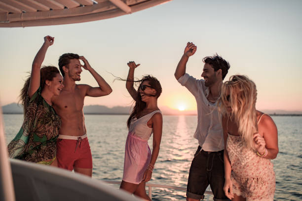 istock Carefree friends having fun while dancing on a boat. 1326035298