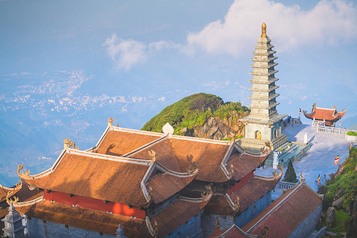 Travel destination,Stone Pagoda in Temple with blue sky. on Fansipan mountain peak the highest mountain in Indochina.