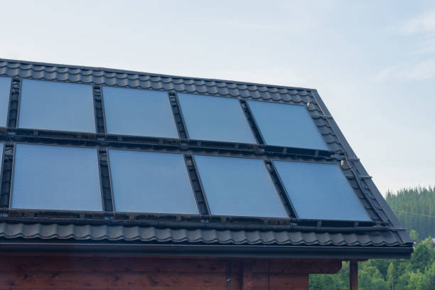 istock Solar thermal heating system for hot water on grey roof. 1326039998