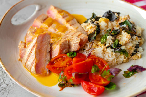 istock Grilled pork chop and rice with sauce 1326040140