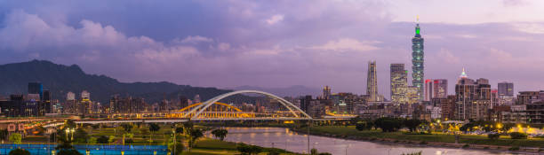 istock Taipei 101 glittering skyscraper cityscape panorama overlooking river Taiwan 1326040164