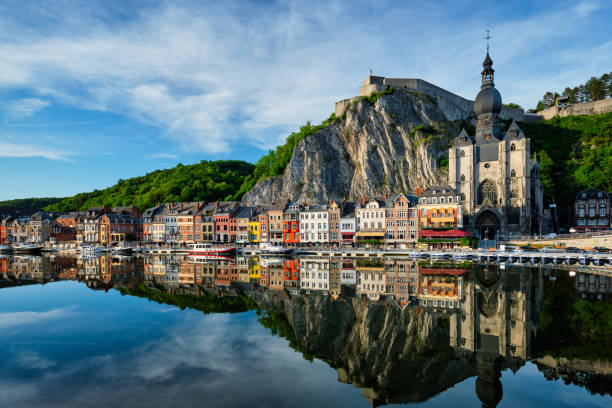 View of picturesque Dinant town. Belgium View of picturesque Dinant town, Dinant Citadel and Collegiate Church of Notre Dame de Dinant over the Meuse river. Belgian province of Namur, Blegium belgium stock pictures, royalty-free photos & images