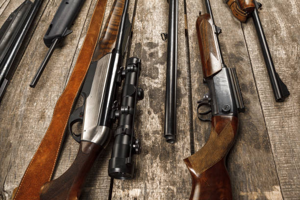 istock Many hunting rifles on weathered wooden surface 1326041542