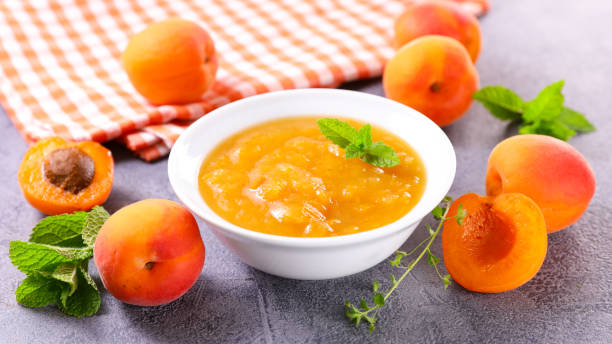 fresh apricot compote in bowl fresh apricot compote in bowl compote stock pictures, royalty-free photos & images