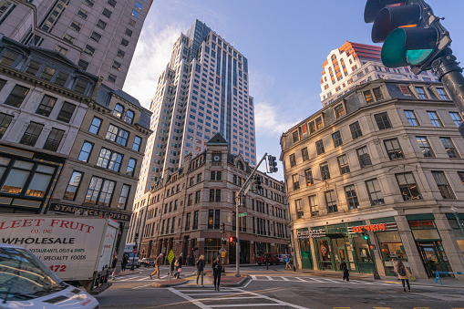 street and transportation traffic car with tall modern finance building in downtown Boston Massachusetts, United States