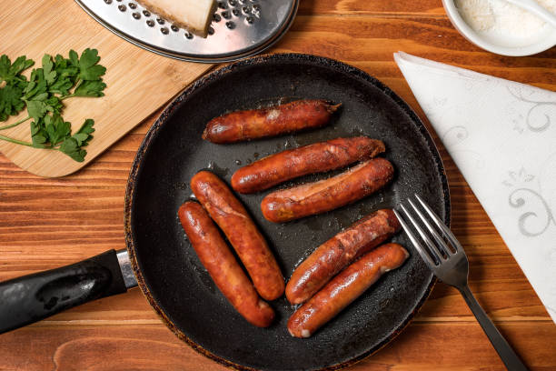 istock Sausages in frying pan 1326041922